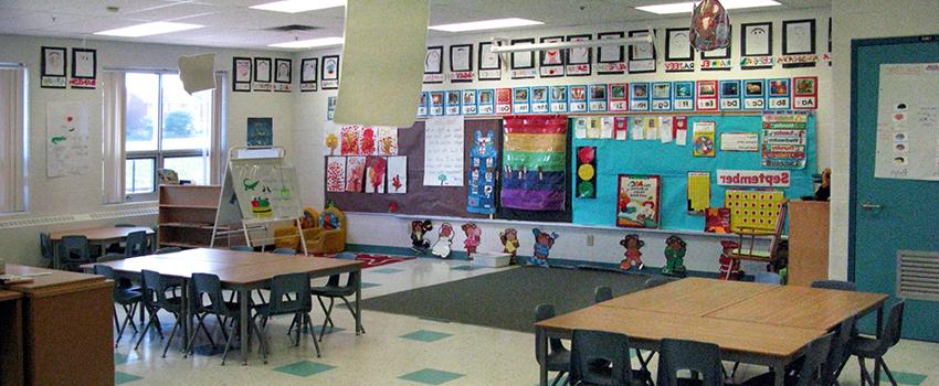 Elementary classroom with tables and chairs